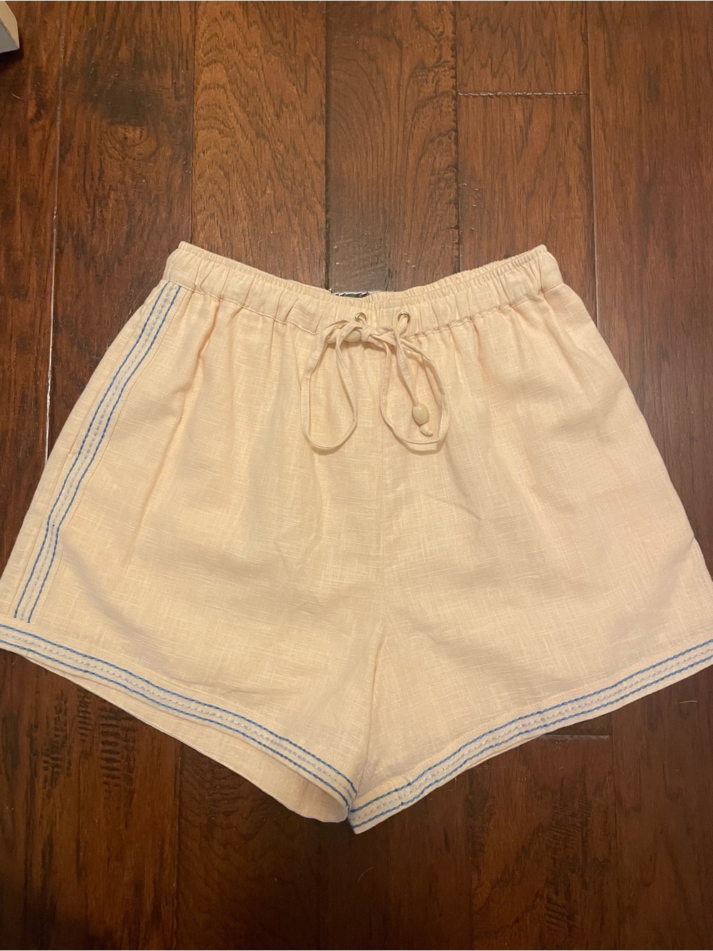 SANCIA Raye Shorts  Cream Drawstring Athletic Shorts with Blue Trim